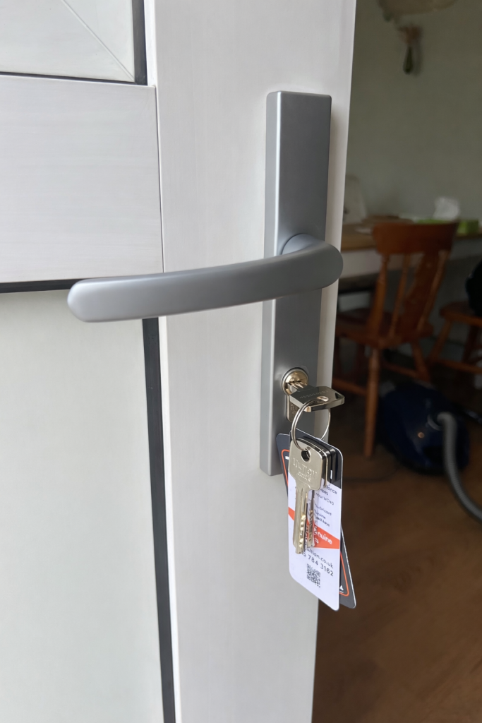New handle and cylinder lock on an open door.