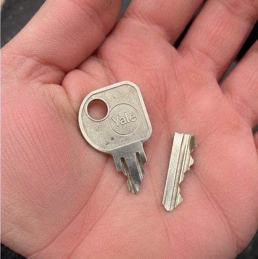 snapped key being held in hand.