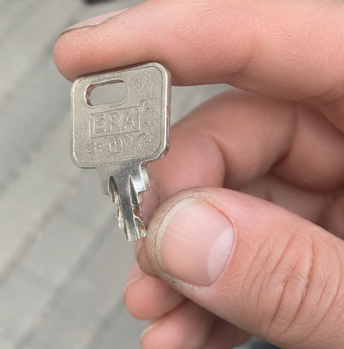 Bent and snapped key being held.
